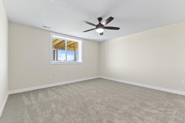 612 W Walnut Pl, Norwalk, IA 50211 - spare room featuring carpet flooring, a ceiling fan, and a textured ceiling