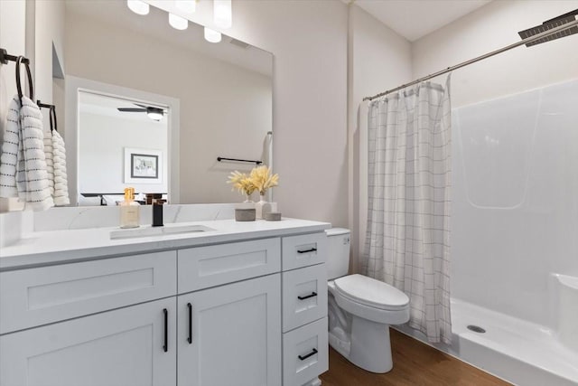 612 W Walnut Pl, Norwalk, IA 50211 - full bath featuring vanity, a shower with curtain, and wood finished floors