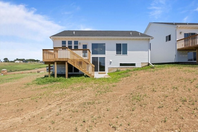 612 W Walnut Pl, Norwalk, IA 50211 - rear view of house featuring a deck and stairway
