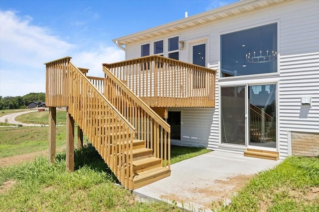 612 W Walnut Pl, Norwalk, IA 50211 - back of property with stairs and a wooden deck