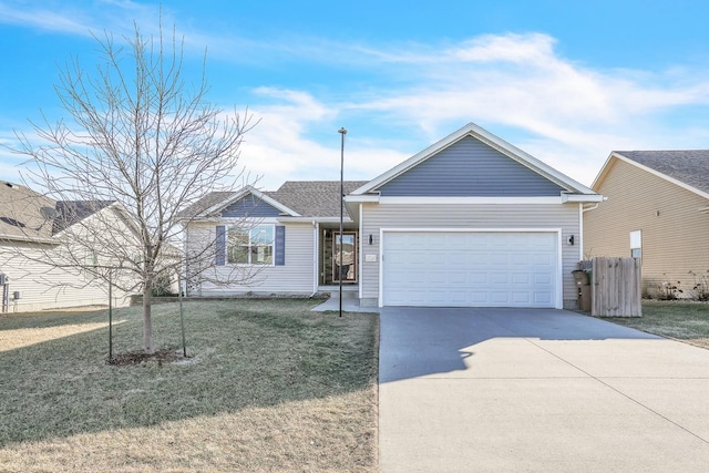 ranch-style house featuring a garage and a front lawn