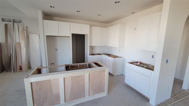 kitchen featuring white cabinetry and a center island