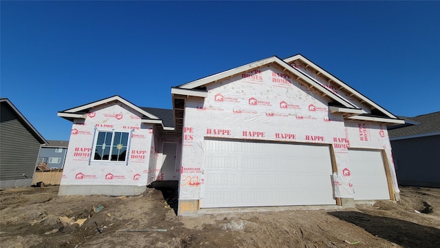 property in mid-construction featuring a garage