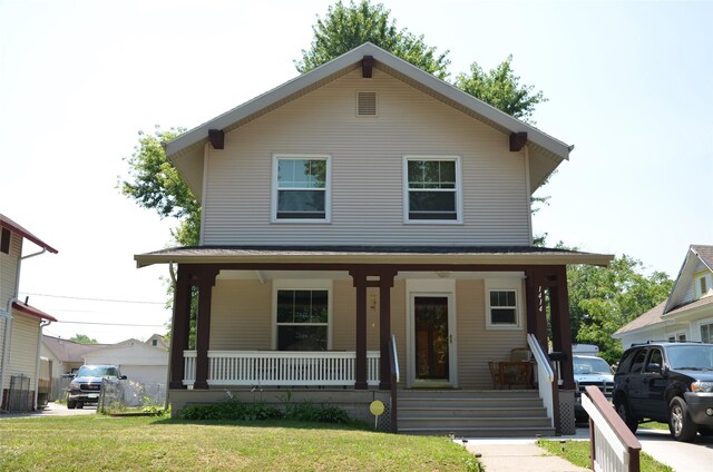 view of front of property with a porch and a front lawn