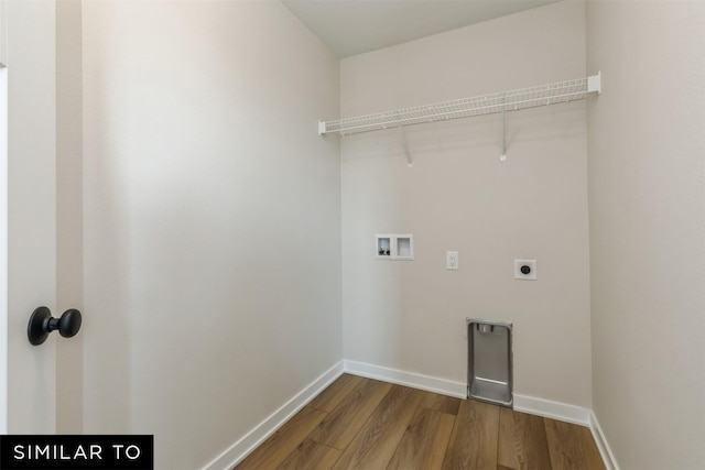 washroom featuring wood-type flooring, hookup for an electric dryer, and hookup for a washing machine