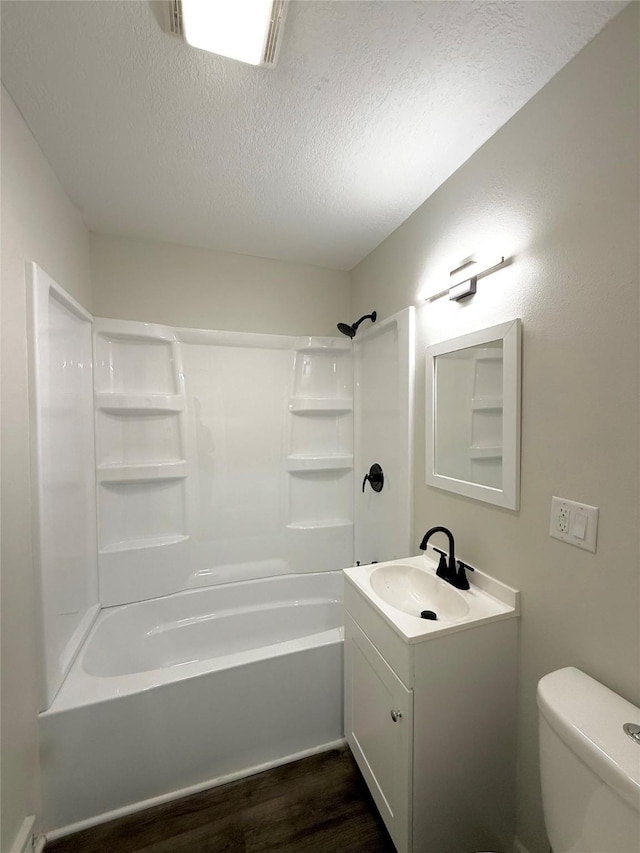 full bathroom featuring toilet, a textured ceiling, shower / bathtub combination, vanity, and hardwood / wood-style flooring