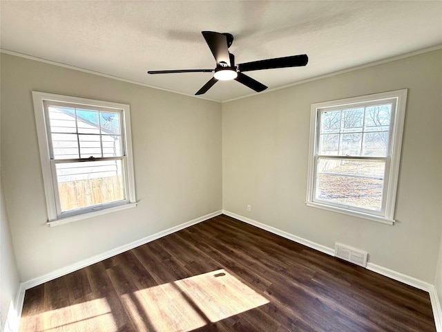 unfurnished room with dark hardwood / wood-style flooring, ceiling fan, ornamental molding, and a textured ceiling