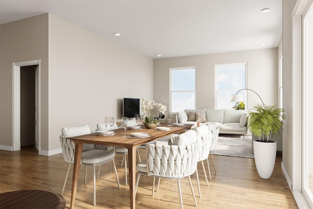 dining space with light hardwood / wood-style floors