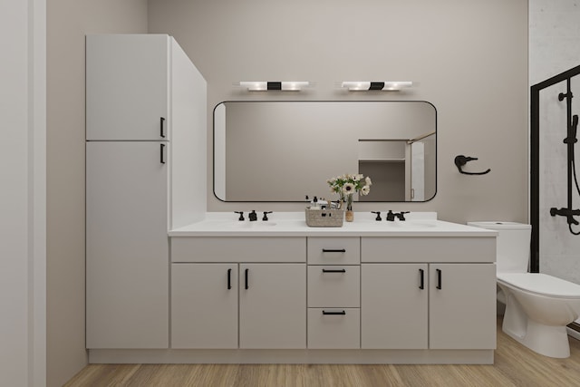 bathroom featuring vanity, wood-type flooring, toilet, and walk in shower