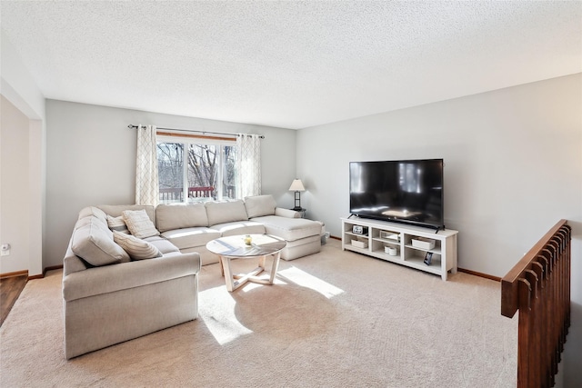 living room with carpet flooring and a textured ceiling