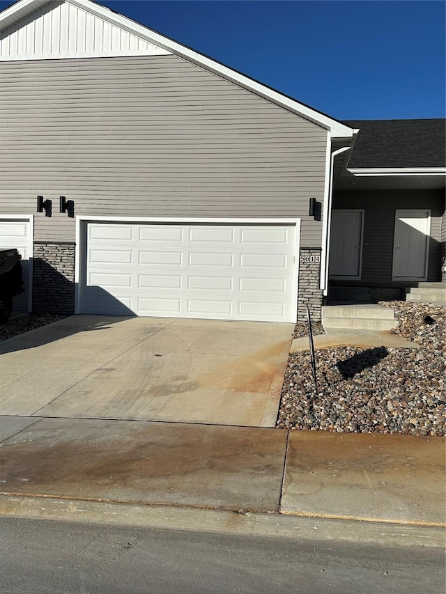 view of side of property with a garage