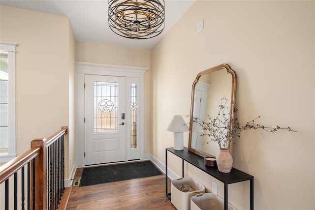 foyer entrance with dark hardwood / wood-style flooring