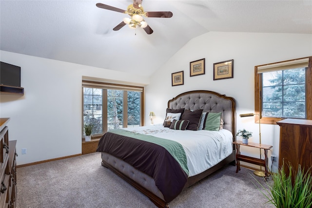 bedroom with multiple windows, lofted ceiling, carpet, and baseboards