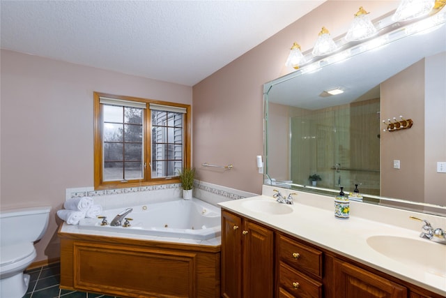 full bath with a whirlpool tub, a shower stall, toilet, and a sink