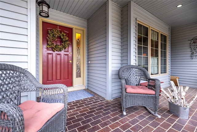 view of exterior entry with covered porch