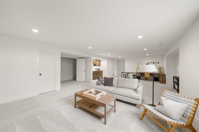 1083 NW 35th St, Grimes, IA 50111 - living area featuring recessed lighting, light carpet, and baseboards