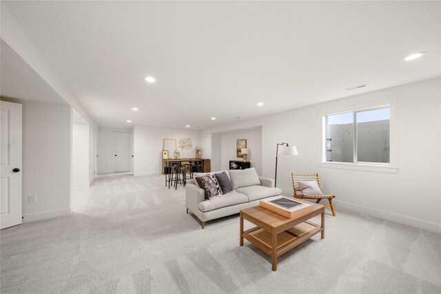 1083 NW 35th St, Grimes, IA 50111 - living room featuring light carpet, recessed lighting, and baseboards