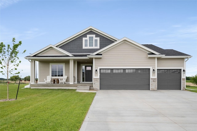 1083 NW 35th St, Grimes, IA 50111 - view of front of house featuring covered porch, driveway, a garage, and a front lawn