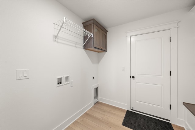 1083 NW 35th St, Grimes, IA 50111 - laundry area with hookup for a washing machine, hookup for an electric dryer, light wood-style flooring, baseboards, and cabinet space
