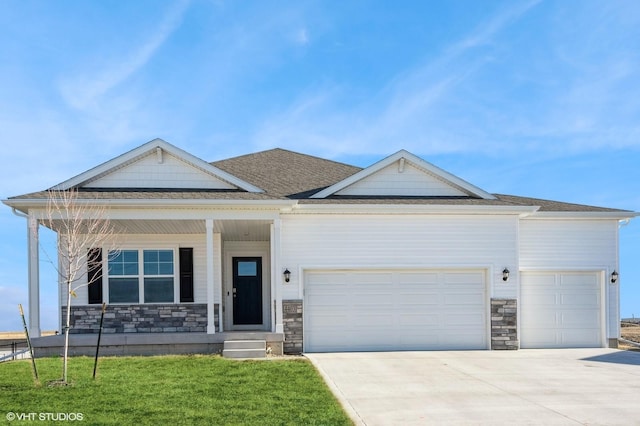 view of front of property with a garage and a front yard