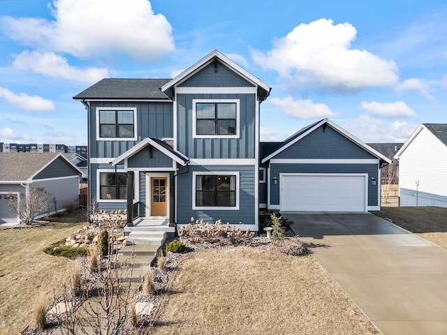 view of front of home with a garage and a front yard