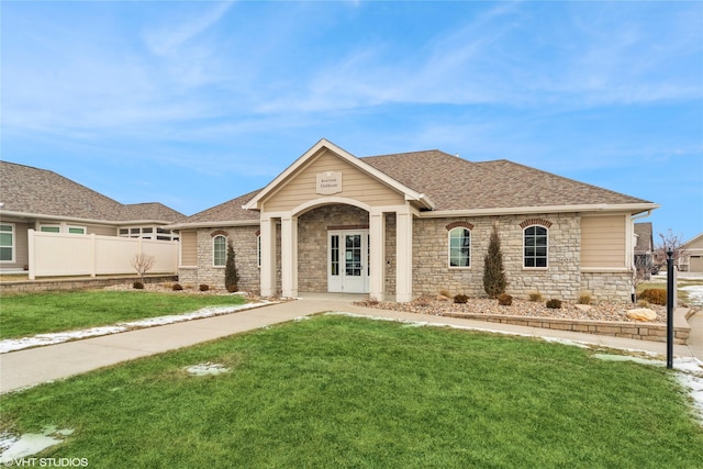 view of front of home featuring a front lawn and french doors