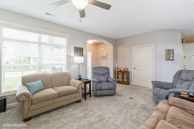 living room featuring ceiling fan and light carpet