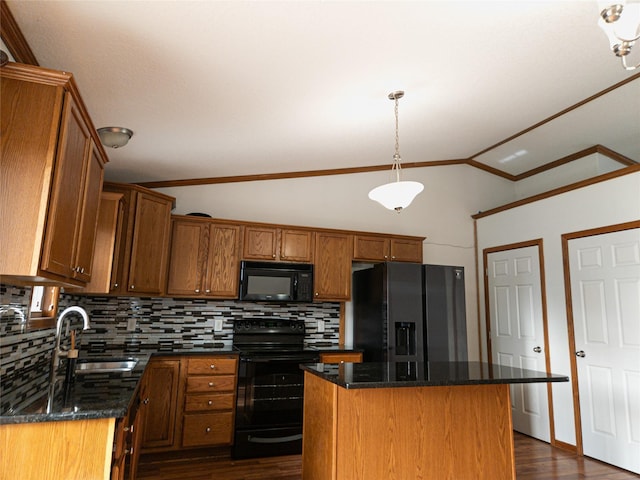 kitchen with sink, vaulted ceiling, a kitchen island, dark stone counters, and black appliances