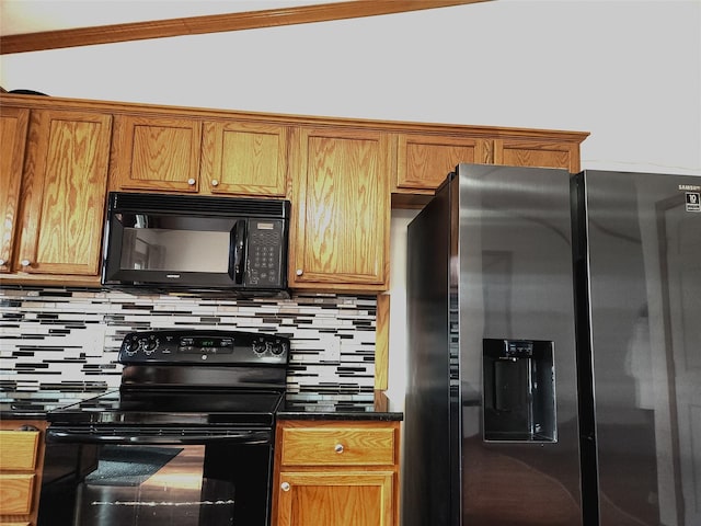 kitchen featuring tasteful backsplash and black appliances