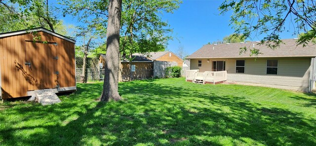 5804 Snyder Ave, Des Moines, IA 50322 - view of yard with a storage shed, an outbuilding, and a deck