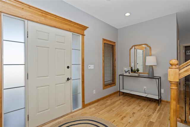 foyer entrance with light wood-type flooring