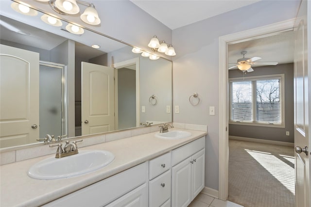 bathroom featuring vanity, tile patterned flooring, a shower with door, and ceiling fan