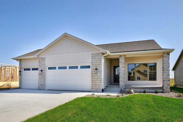 view of front facade featuring a garage and a front yard