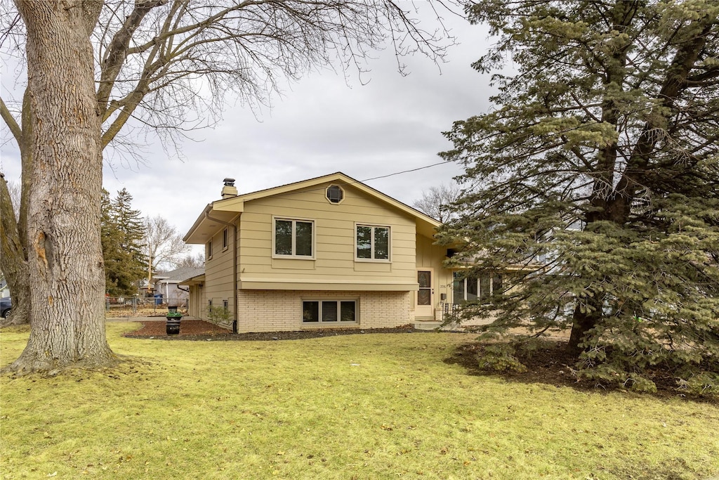 rear view of house with a lawn