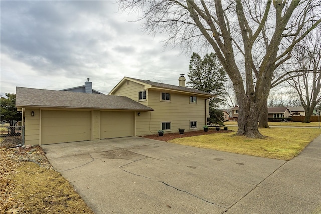 view of home's exterior featuring a yard and a garage