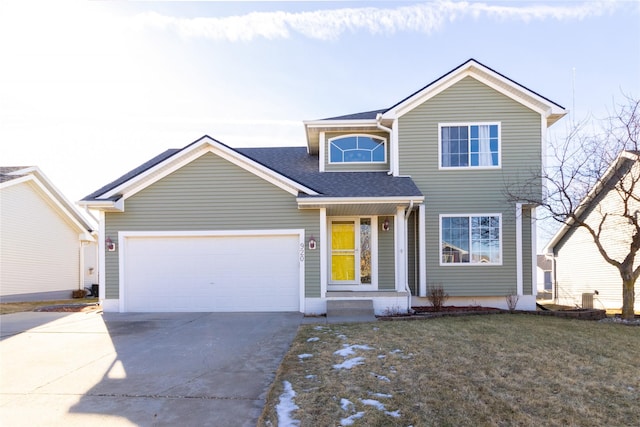 view of front of home featuring a garage and a front lawn