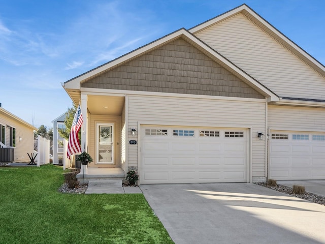 view of front of property featuring a garage and a front yard