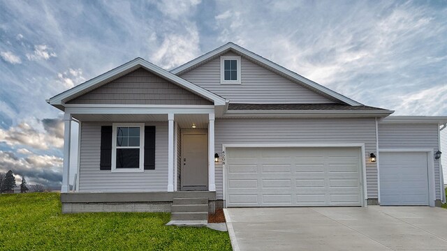 view of front of house featuring a garage and a front yard