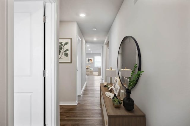 corridor featuring dark wood-type flooring