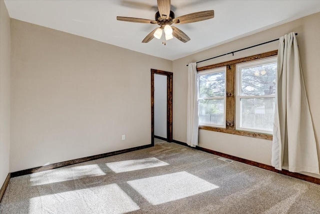 empty room featuring ceiling fan and carpet floors