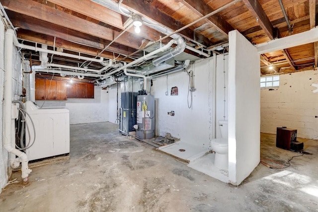 basement featuring washer / clothes dryer and gas water heater