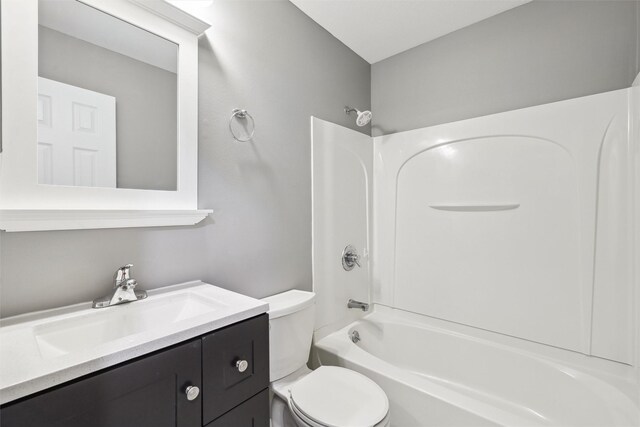 full bathroom featuring vanity, tub / shower combination, and toilet