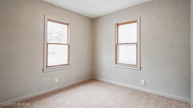 empty room featuring carpet floors