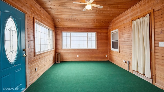 unfurnished sunroom featuring lofted ceiling, wooden ceiling, and ceiling fan