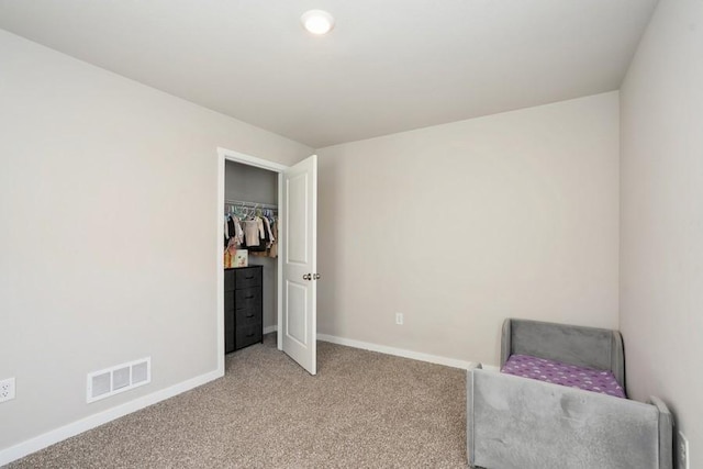 bedroom with light colored carpet