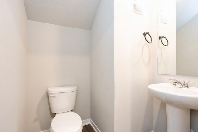 bathroom featuring sink and toilet