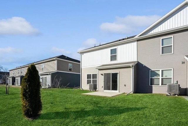 back of property featuring cooling unit, a yard, and a patio area