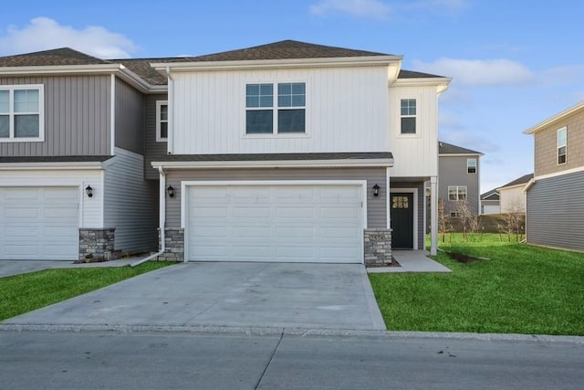 view of front of home featuring a garage and a front lawn