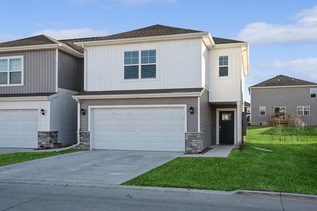 view of front of property with a garage and a front yard