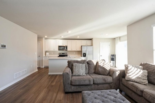 living room with dark hardwood / wood-style floors